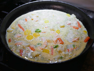 Vegetables fried in a pan close-up. Steam is coming. Defocus. vegetarian barely. Eco food.