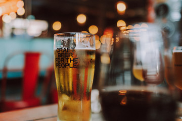 Closeup of craft beer glass at restaurant