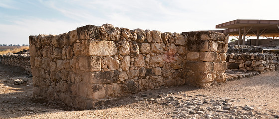 the south side of the stone gate to the ancient israelite and canaanite cities at the tel hazor archaeological site in israel with the canaanite palace in the background