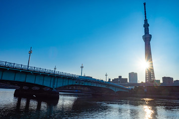 Naklejka premium Japan. Tokyo. Tokyo Sky Tree. Bridge over the river. Dawn in the Japanese city. Tokyo Television Tower on a background of blue sky. Morning Japan. Japanese sights. River in the Japanese capital