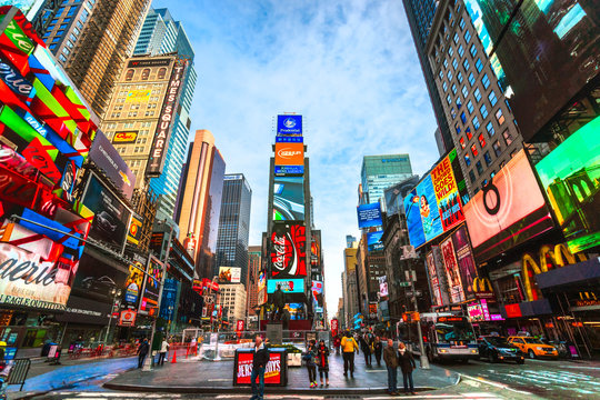 NEW YORK CITY, USA - DECEMBER 01, 2013: Times Square,is a busy tourist intersection of neon art and commerce and is an iconic street of New York City and America.