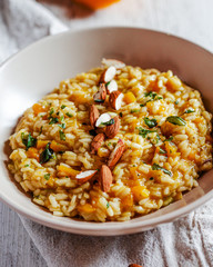Risotto with pumpkin with sliced almonds. Vegan food