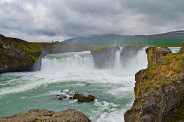 Breathtaking view of impressive power and magic of powerful Iceland Godafoss Waterfall Cascade with...