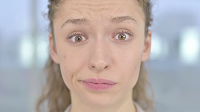 Close Up of Surprised Young Woman feeling Shocked