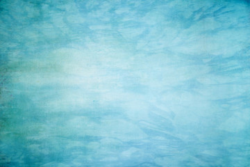 Fototapeta na wymiar blaue Aquarellfarben auf Papier Hintergrund - künstlerisches Design Element