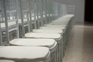 White color coatted on wooden chair Fabric Cloth Empty Many Seats Row Column in Movie Theatre Concert or Siminar Conference room