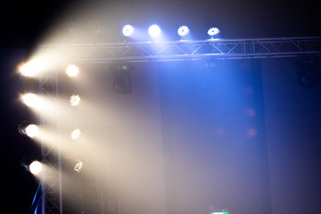 Performance moving lighting luminous rays on construction light beam ray downward in yellow color,...
