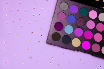 Makeup eyeshadow palette, with rhinestones spreaded around, can fit for instagram pages