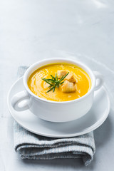 Seasonal spicy fall autumn creamy pumpkin and carrot soup