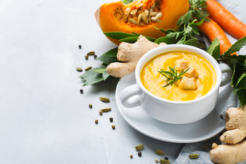 Seasonal spicy fall autumn creamy pumpkin and carrot soup