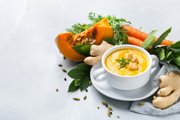Seasonal spicy fall autumn creamy pumpkin and carrot soup