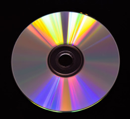 Single CD DVD disc with black background closeup