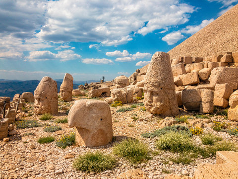 Panoramic view of some of the statues near the peak of Nemrut Dagi. King Antiochus I Theos of Commagene built on the mountain top of Mount Nemrut a tomb-sanctuary flanked by huge statues. Turkey