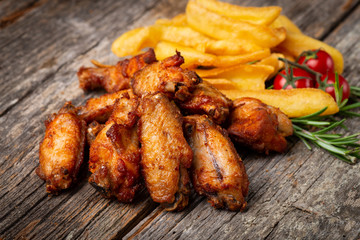 Roasted Chicken with French Fries on the wooden table
