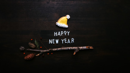 Happy New Year text with gingerbread Santa Claus hat