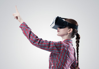 Girl in mask experiencing virtual reality as new entertainment device