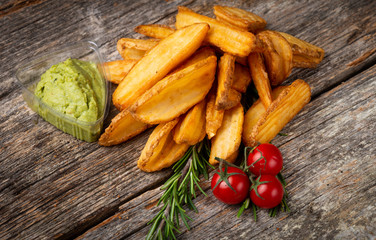 Premium fried potatoes on the wooden table