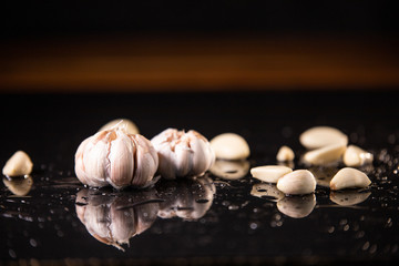 Fresh natural garlic on black background