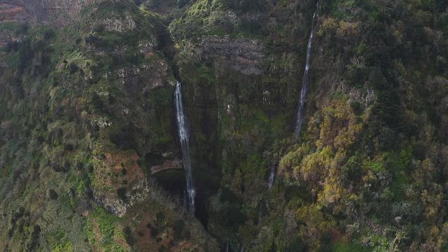 4K Aerial shot of epic waterfall nature background. Jungle rainforest with a powerful stream. 