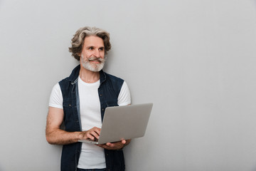 Portrait of a handsome stylish mature man wearing a vest