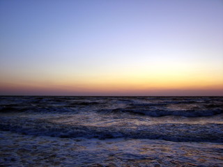 Panorama of the endless horizons of the Sea of ​​Azov under the morning sun at dawn.