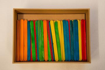 colorful lollipops sticks in a box