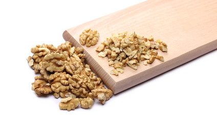 Walnut kernels, pile isolated on white background, top view