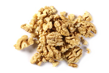 Walnut kernels, pile isolated on white background, top view