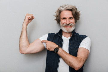 Portrait of a handsome stylish mature man wearing a vest