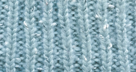 Knitted light blue pullover texture, closeup. Knitted fabric texture. Soft light wool background, close-up.