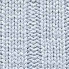 Fototapeta na wymiar Knitted light blue pullover texture, closeup. Knitted fabric texture. Soft light wool background, close-up.
