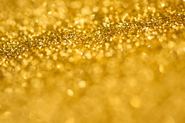 Gold glitter bokeh lights  .Defocused illumination for holidays backgrounds