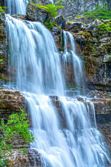 Obraz premium Waterfall in Italian Alps, Cascate di Mezzo Vallesinella, Trentino, Italy