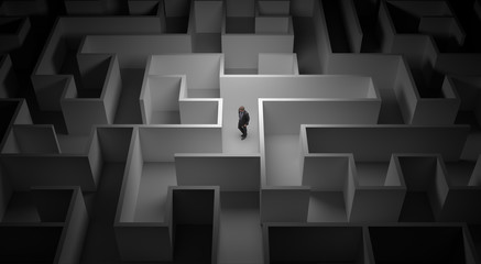 Business man lost in the center of a maze