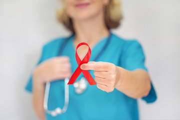 AID, HIV red ribbon. Symbol of awareness, charity, support in disease, illness, ill. AIDS, HIV. A...
