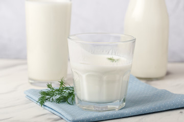 Dairy products, health concept, in glassware, on a light gray background