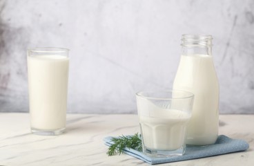 Dairy products, health concept, in glassware, on a light gray background