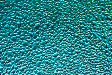 Beautiful abstract water background. blurry drops of water on the glass.