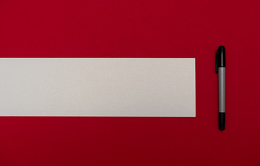 Marker on blank colored textured paper. Place for text. Top view. Background for presentation.