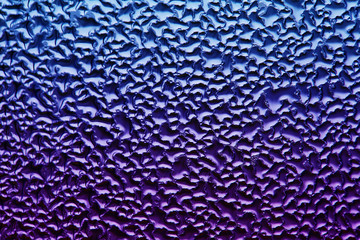 Beautiful gradient abstract water background. blurry drops of water on the glass.