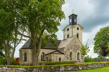 Fototapeta na wymiar Swedish medieval church in summer sunlight