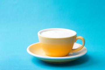yellow cup on a blue background