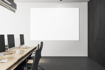 Coworking office with blank poster