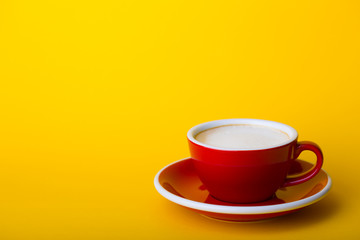 red cup on a  yellow background