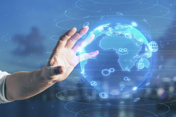 Hand using glowing social network hologram.