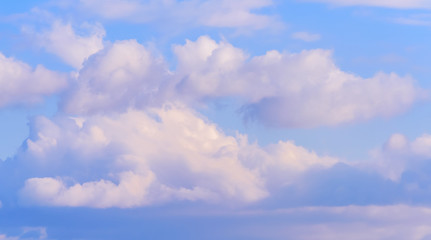 Dramatic puffy fluffy clouds isolated against blue skies