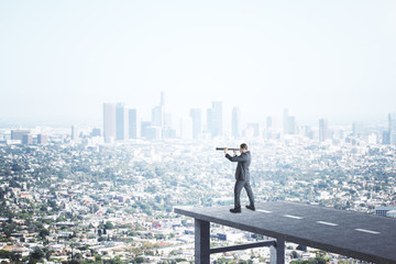 Businessman standing on end road