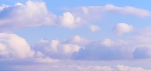 Dramatic puffy fluffy clouds isolated against blue skies