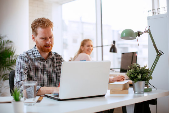 Businessman At Office Working. Attractive Red Hair Businessman. 