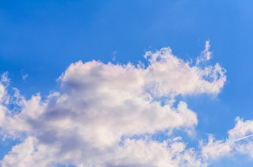 Dramatic puffy fluffy clouds isolated against blue skies